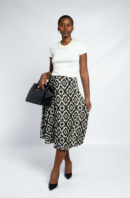 GLOW LADIES PRINTED PLEATED SKIRT-BLK | STON