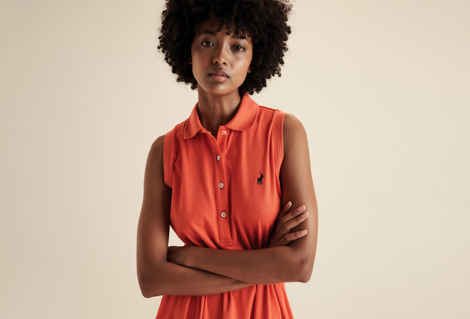 Lady in orange Polo dress. Shop women's clothing at Options Botswana.